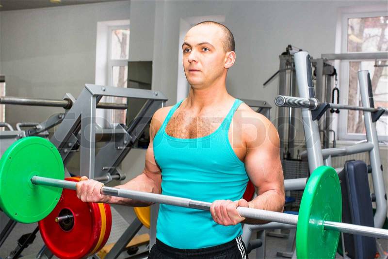 Young man training in the gym, stock photo