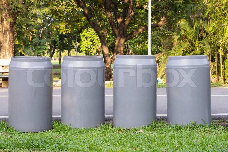 Four recycle bins in the park , stock photo