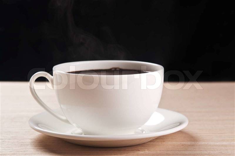 White cup of coffee on black background, stock photo
