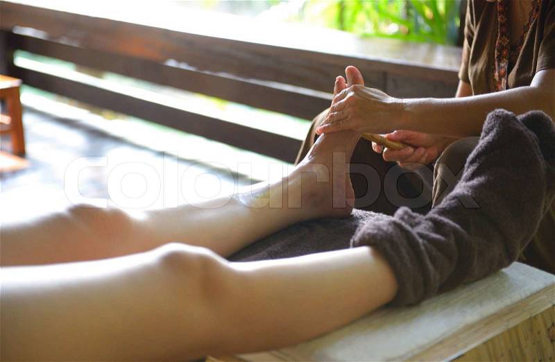 The women massage her foot for thai spa foot massage, stock photo