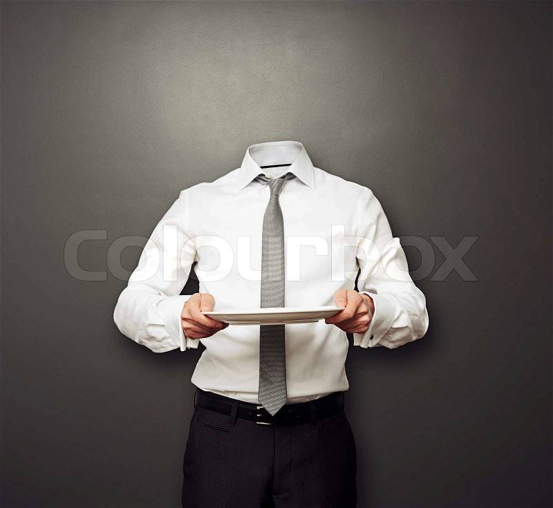 Invisible man holding empty plate, stock photo