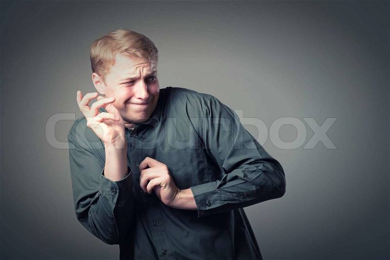 Young Man Holding His Hands Out In Fear, stock photo