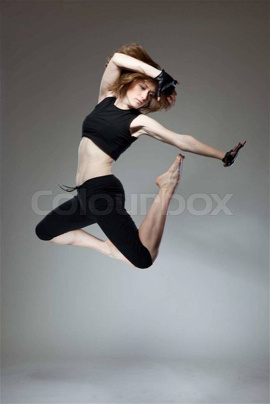 Attractive jumping woman , stock photo