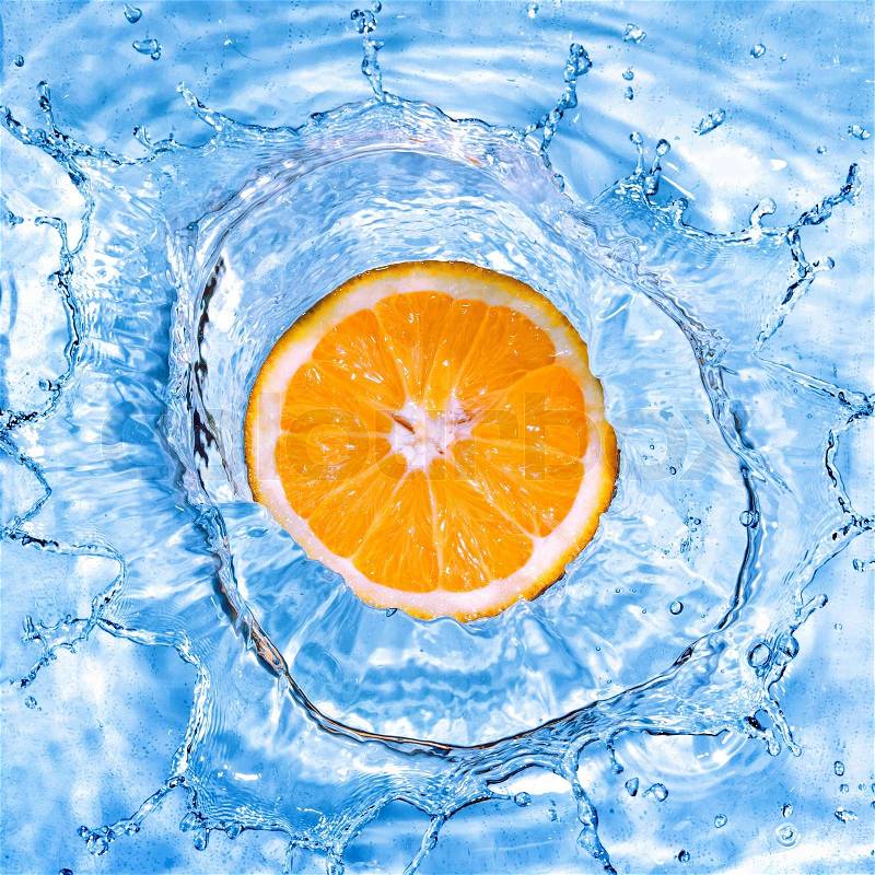 Fresh orange dropped into water with bubbles isolated on white, stock photo