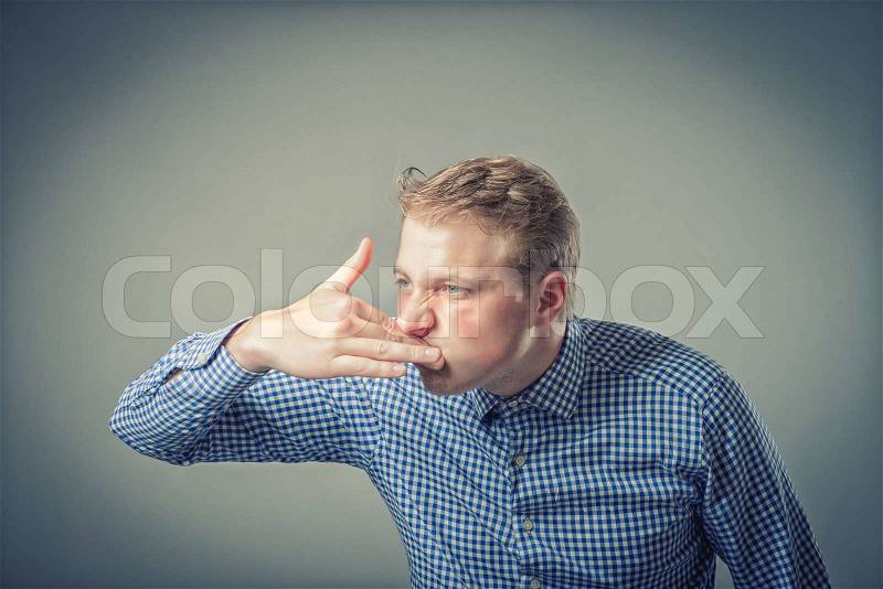 Businessman with a strong toothache, stock photo