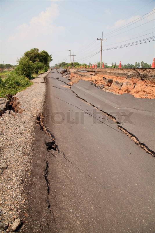 Cracked asphalt road, stock photo