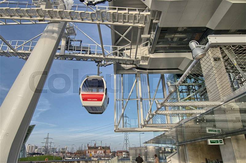 LONDON - DEC 7: Emirates Air Line cable cars, December 7, 2012 in London. The service is the UK\'s first urban cable car running across the Thames from the O2 to the Excel centre, stock photo