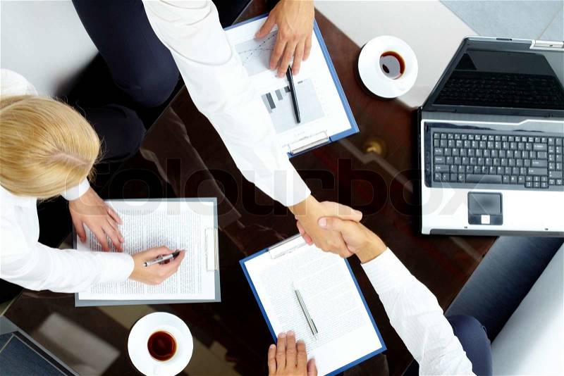 Image of handshake of successful partners after negotiations, stock photo