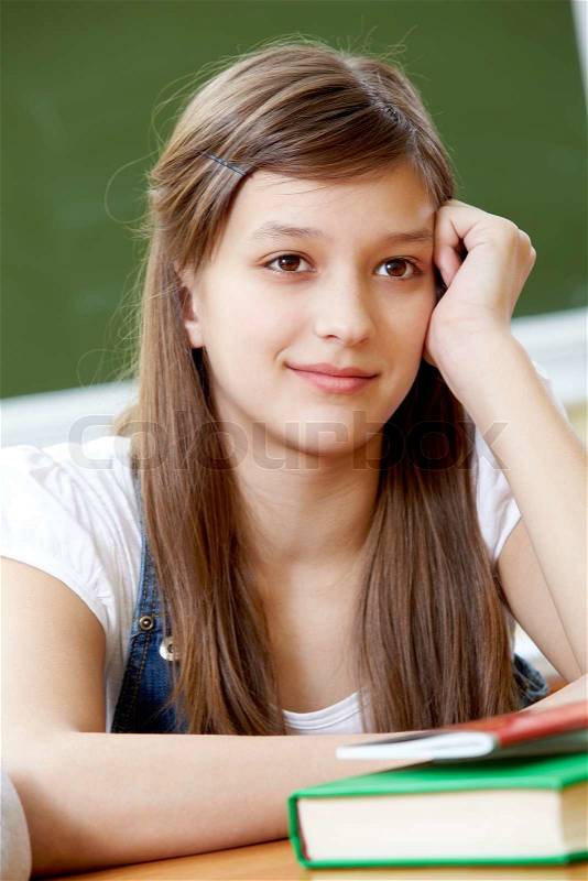 Portrait of pretty girl at workplace interested in subject, stock photo - 6802062-smart-girl