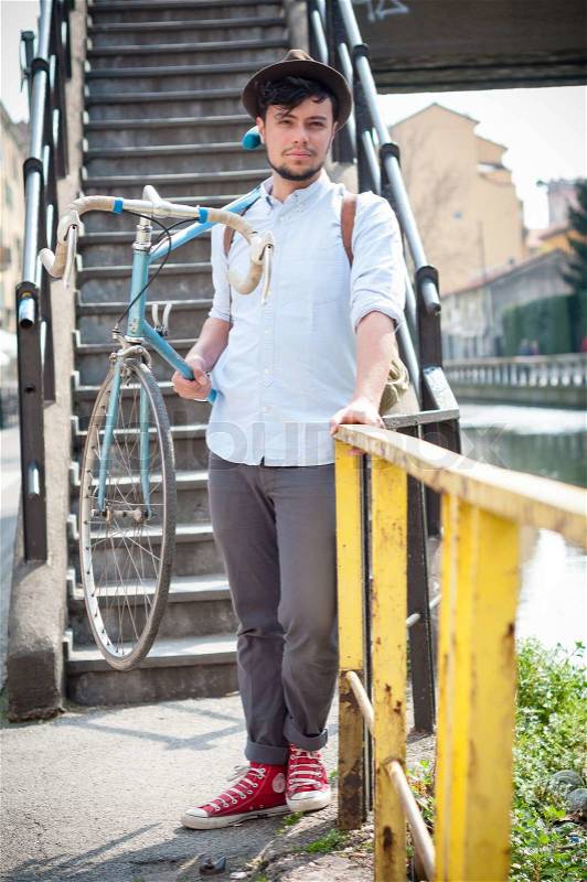 Hipster young man on bike, stock photo