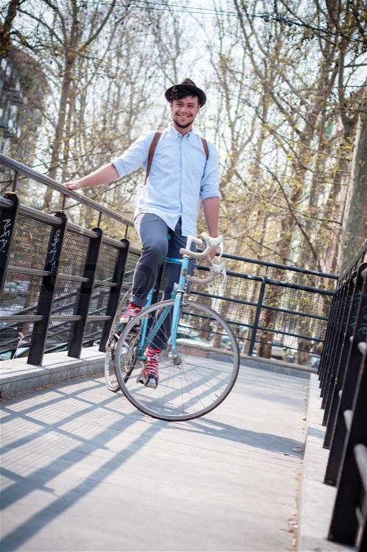 Hipster young man on bike, stock photo