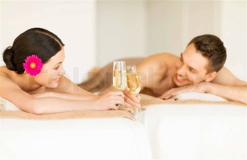Picture of couple in spa salon drinking champagne, stock photo
