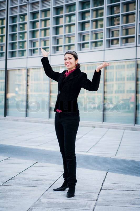 Success business girl in front of modern building, stock photo