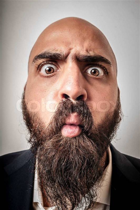 Elegant bearded man with jacket and funny expressions, stock photo