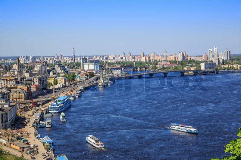 Panorama of city landscape and nature. Kiev, Ukraine. Green trees, architecture, bridges and blue river, stock photo