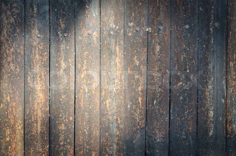 Grunge wood wall panel with light, stock photo