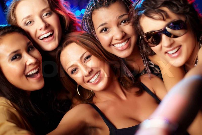 Close-up shot of group of laughing girls having party, stock photo