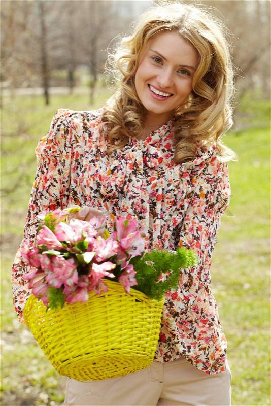 Female with flowers, stock photo