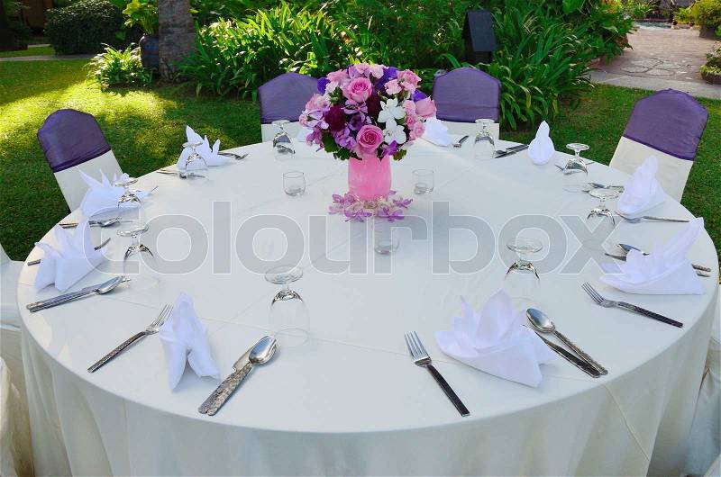 Dinner table set up for wedding party, stock photo