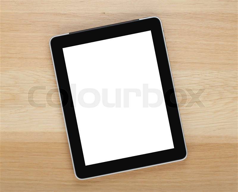 Touch screen tablet computer with blank screen on wooden table, stock photo