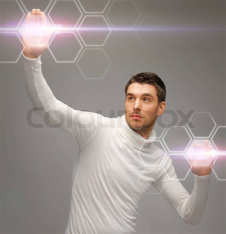 Picture of futuristic man working with virtual screens, stock photo