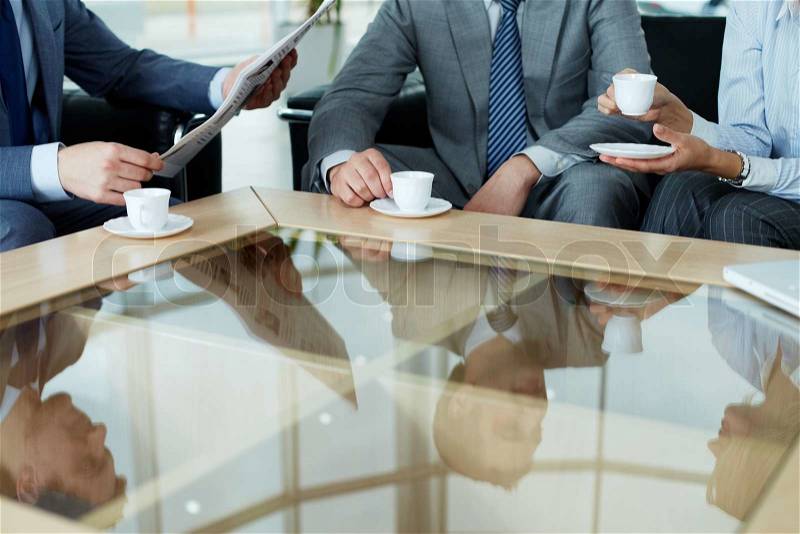 Business team having a break by cup of coffee, stock photo