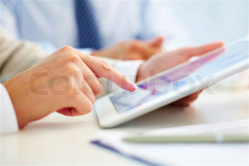 Female office worker using touchpad, stock photo