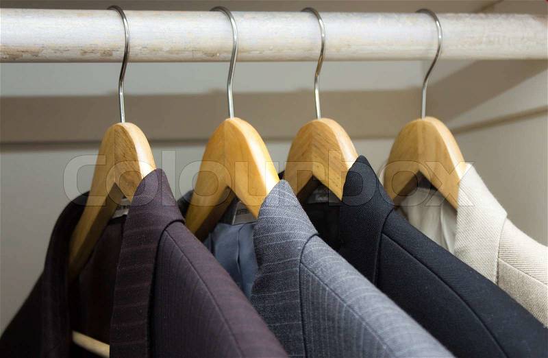 Business suits in the closet, stock photo