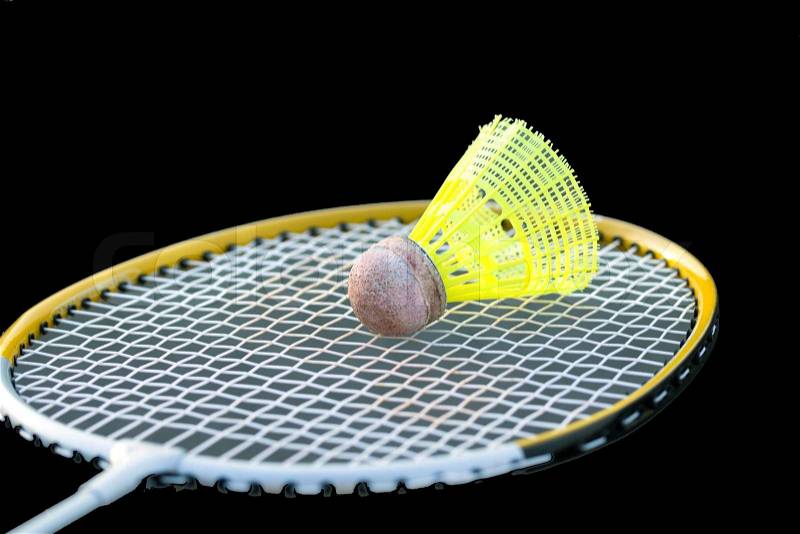 Badminton shuttlecocks on racket, stock photo
