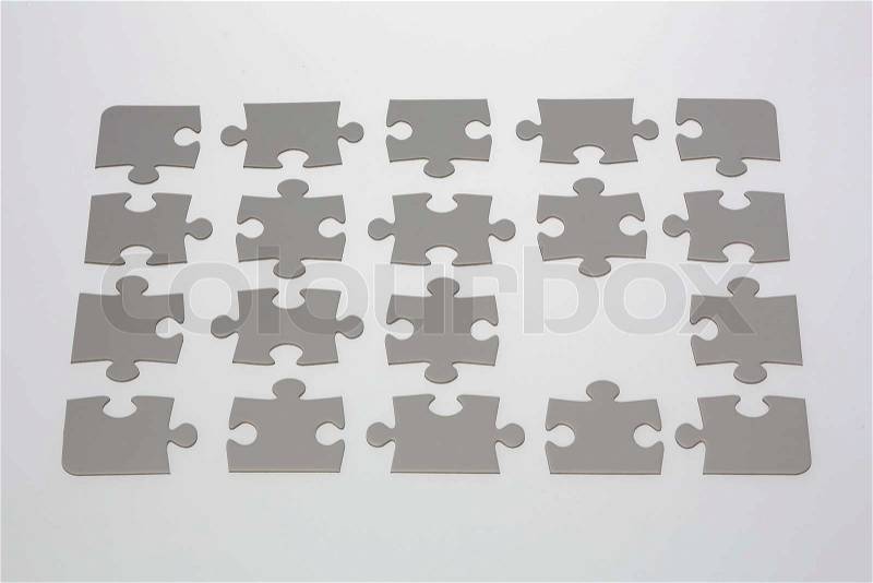 A blank jigsaw puzzle with one piece missing, stock photo