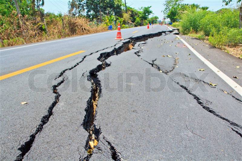 Cracked surface of an asphalt road, stock photo