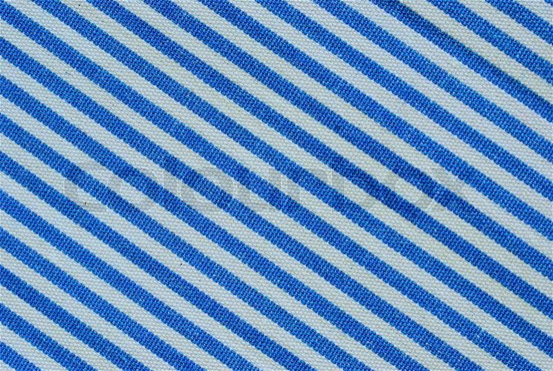 Close up on blue and white line fabric with 30 degree angle background, stock photo