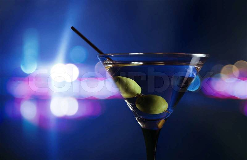 Green olives in wineglass,focus on a olives, stock photo