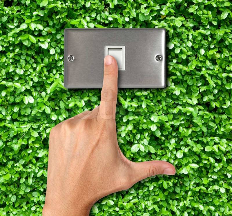 Human finger turn off switch on Plant Background, stock photo