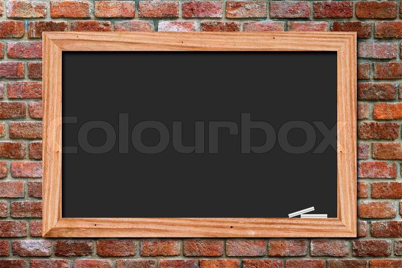 Blackboard on old brick wall background, stock photo