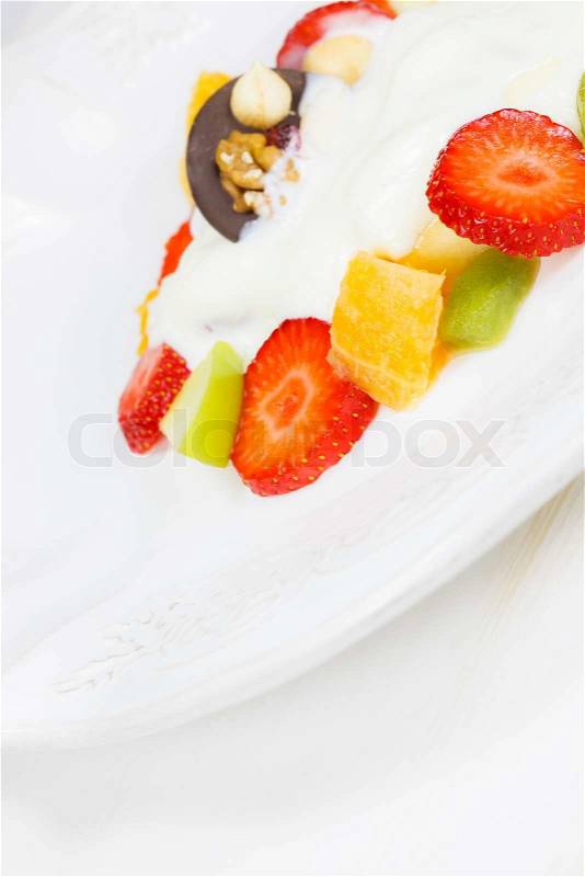 Dessert cream yogurt over fruit, stock photo