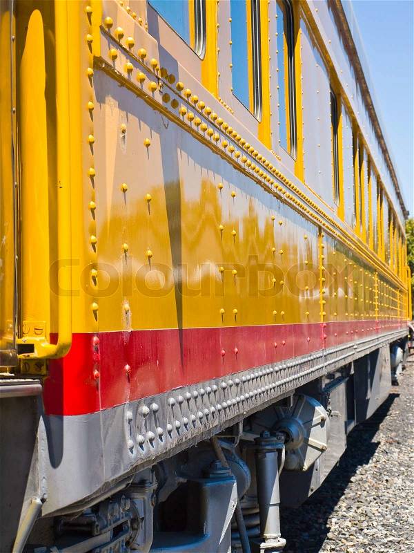 Closeup Side View of an Old-Fashioned Passenger Train, stock photo