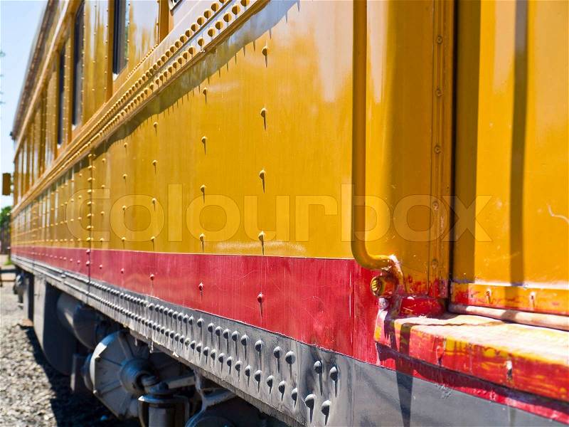 Closeup Side View of an Old-Fashioned Passenger Train, stock photo