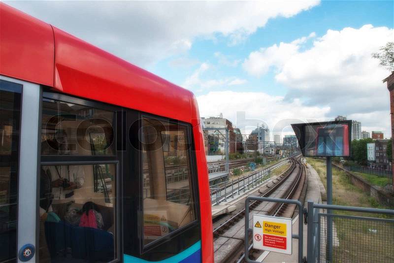 Red train of London public transportation - UK, stock photo