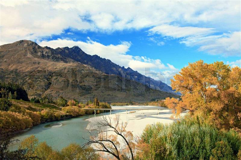 River and Lake From Historic Bridge with Mountain Landscape in Queenstowns New Zealand, stock photo