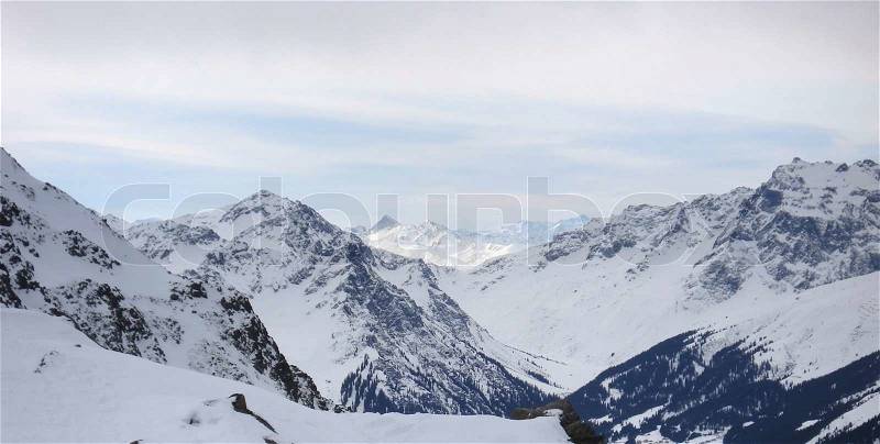 Alpine scenery with snow covered mountains in Austria, stock photo