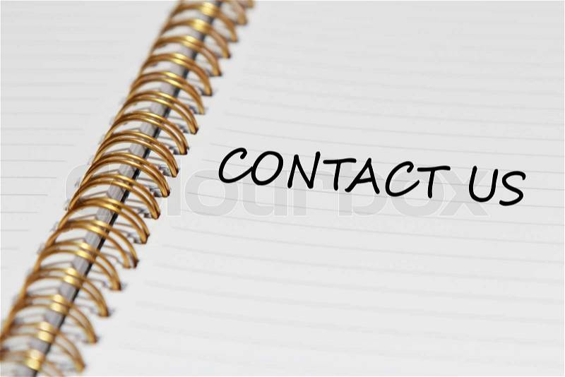 Contact us writing in notebook paper, stock photo