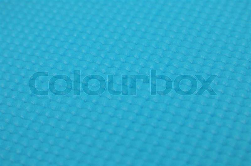 Background of light blue yoga matt, stock photo
