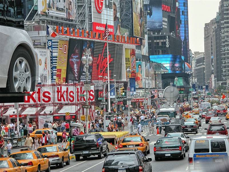 NEW YORK CITY - AUG 11: Times Square ,is a busy tourist intersection of neon art and commerce and is an iconic street of New York City and America, August 11, 2007 in Manhattan, New York City, stock photo
