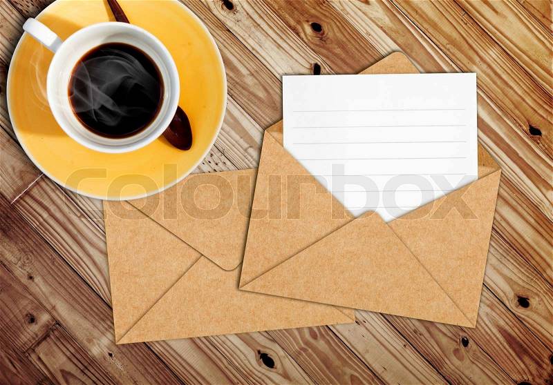 Blank letter with the envelope on coffee table, stock photo