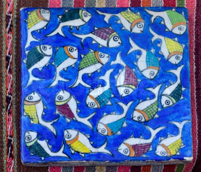 Authentic Mediterranean Ceramic Tile Square with fishes painting, stock photo
