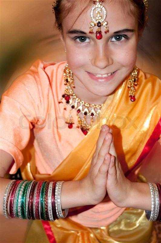 Child wearing bridal Indian clothing, stock photo