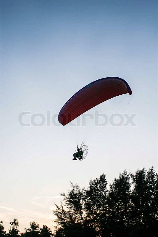 Paraglide or paramotor on forest, stock photo