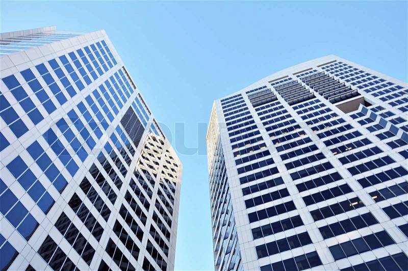 Buildings in blue sky background - looking up angle, stock photo