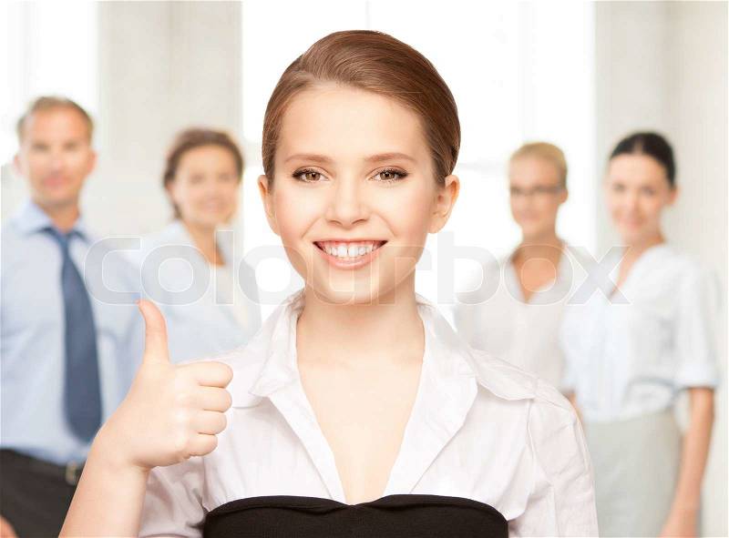 Bright picture of lovely woman with thumbs up, stock photo